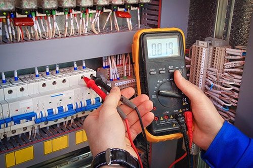 Multimeter in Hand of Electrician — Electricians in Sunshine Coast, QLD